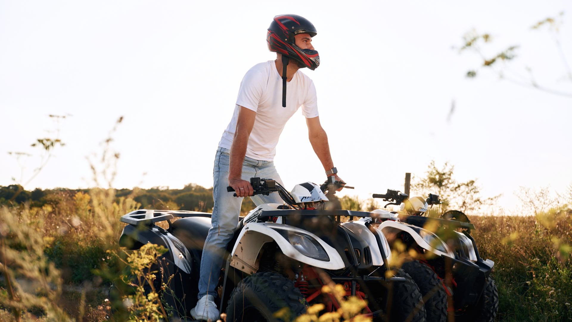 Man standing up on stationery ATV