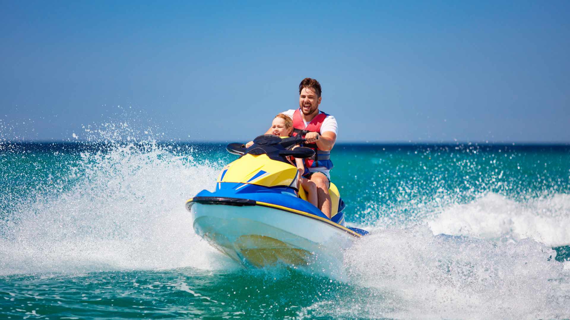 Father and son on jetski