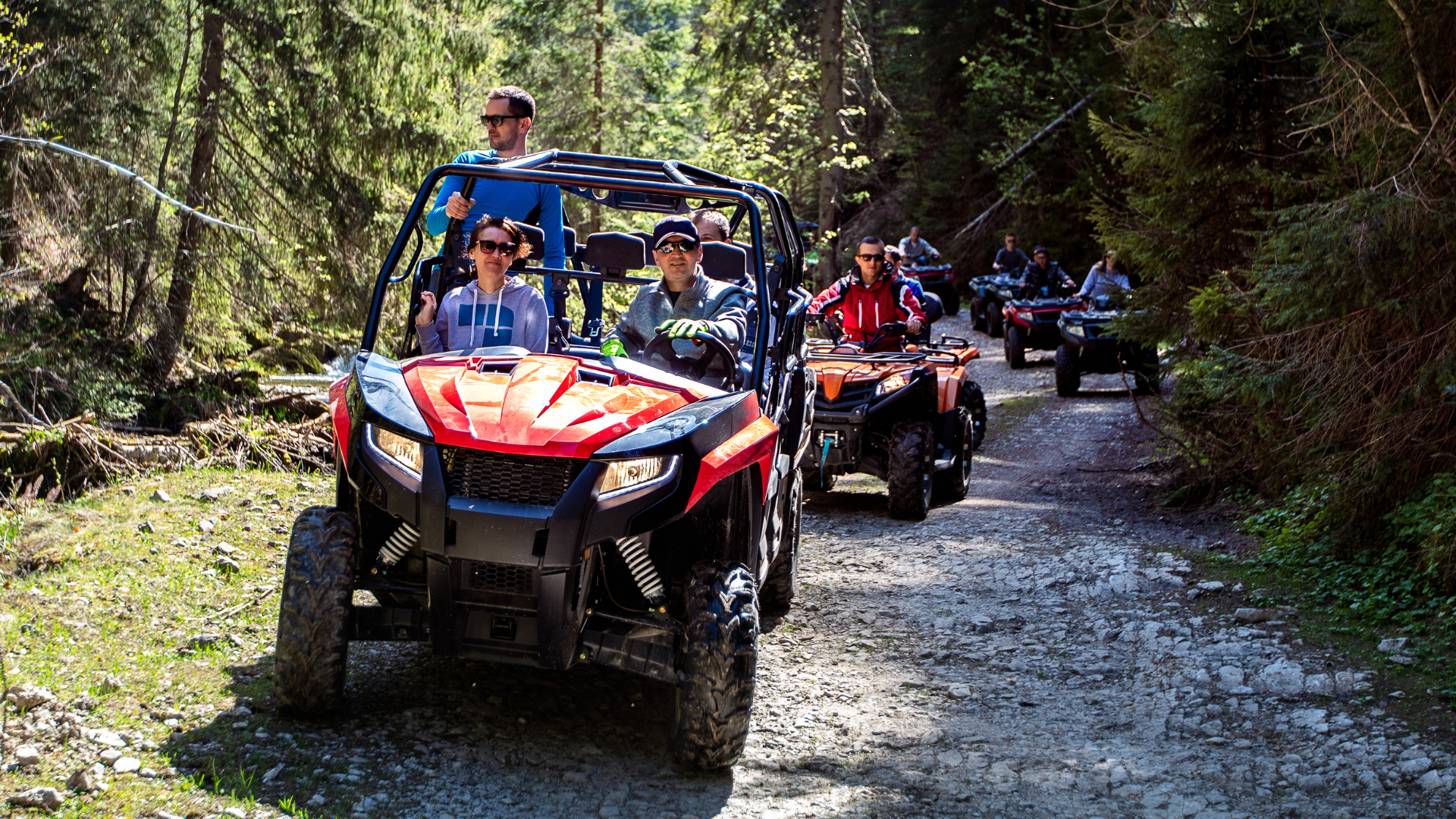 Group riding ATVs and UTVs