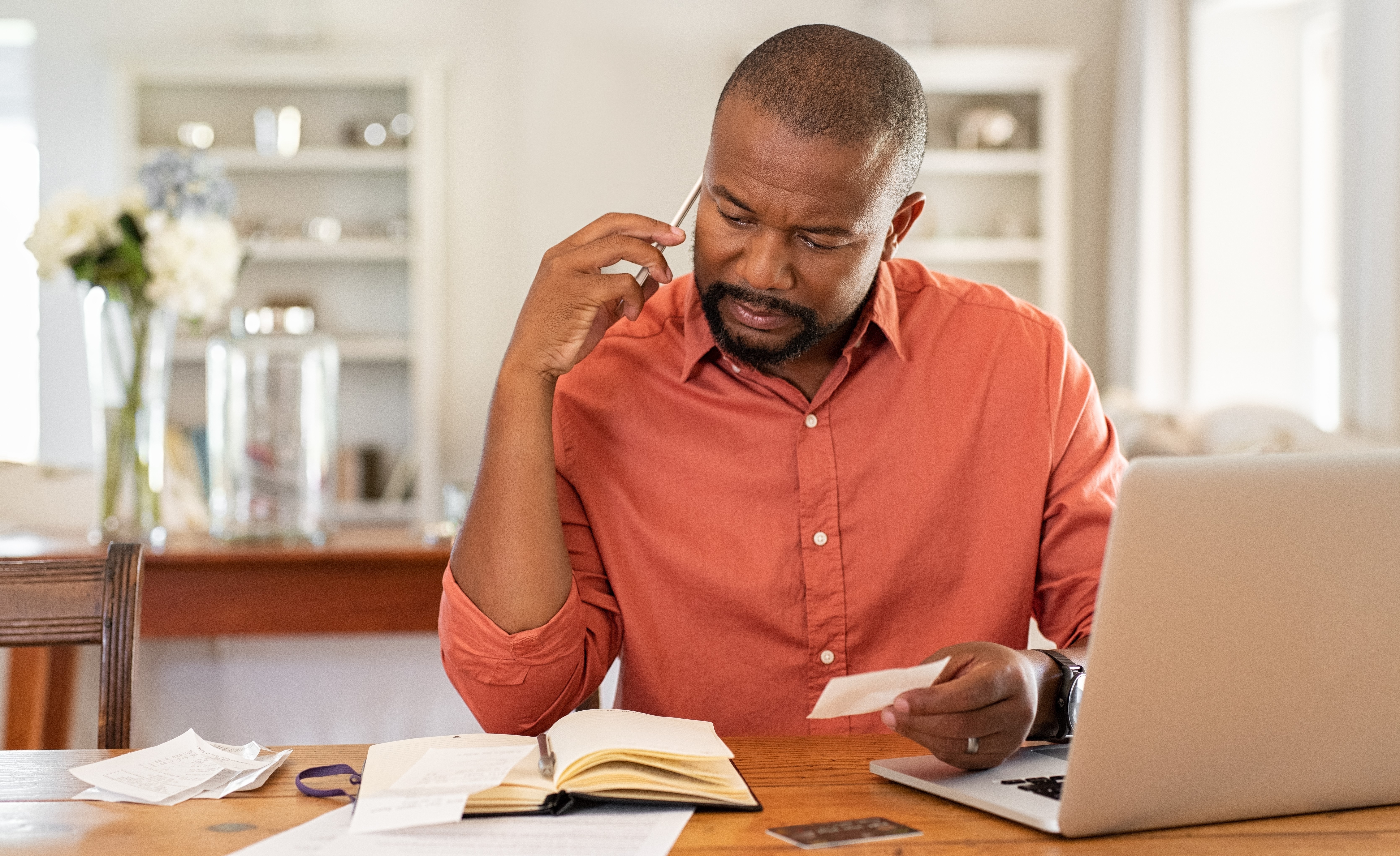 Man looking over receipts