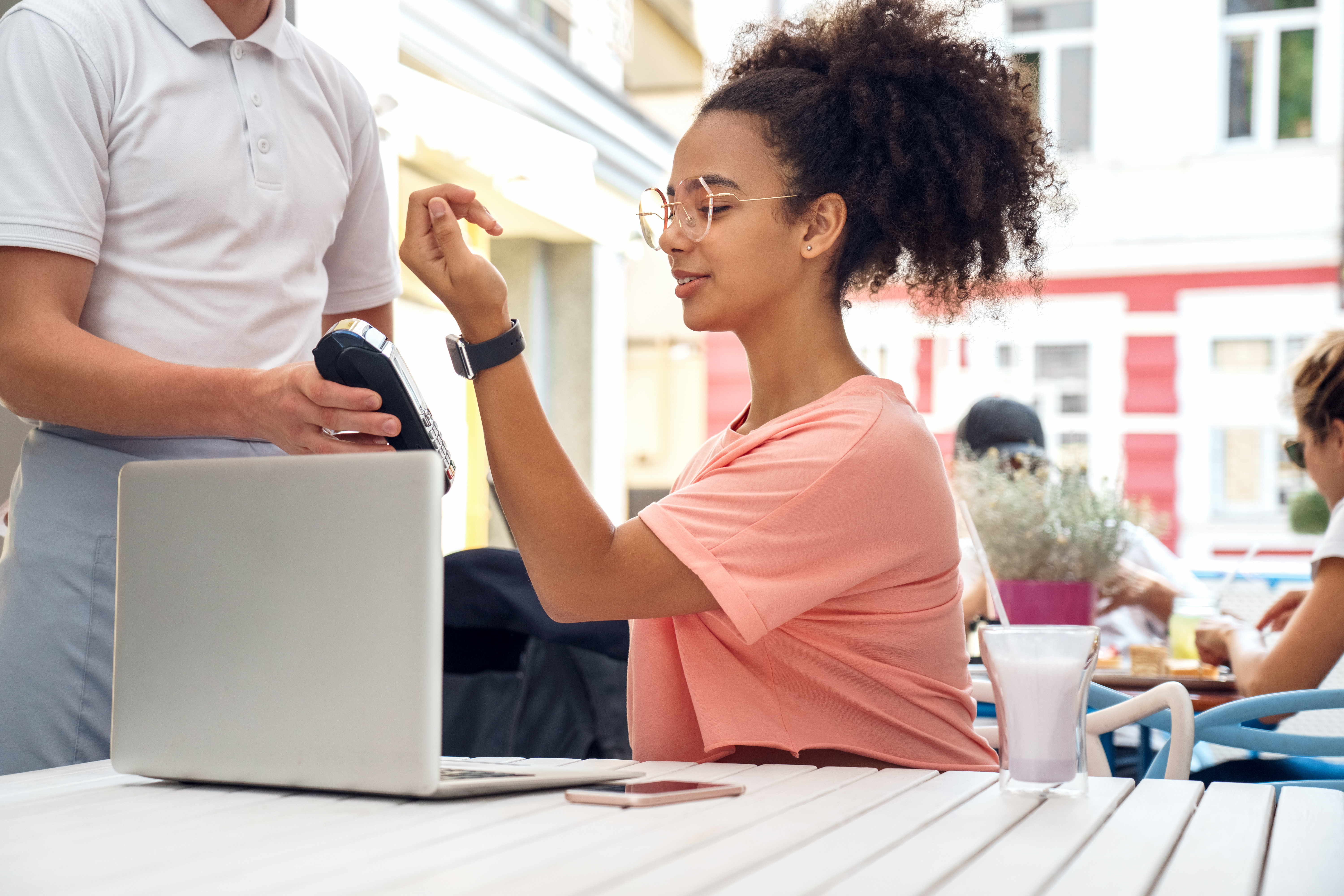 Woman using smartwatch to pay