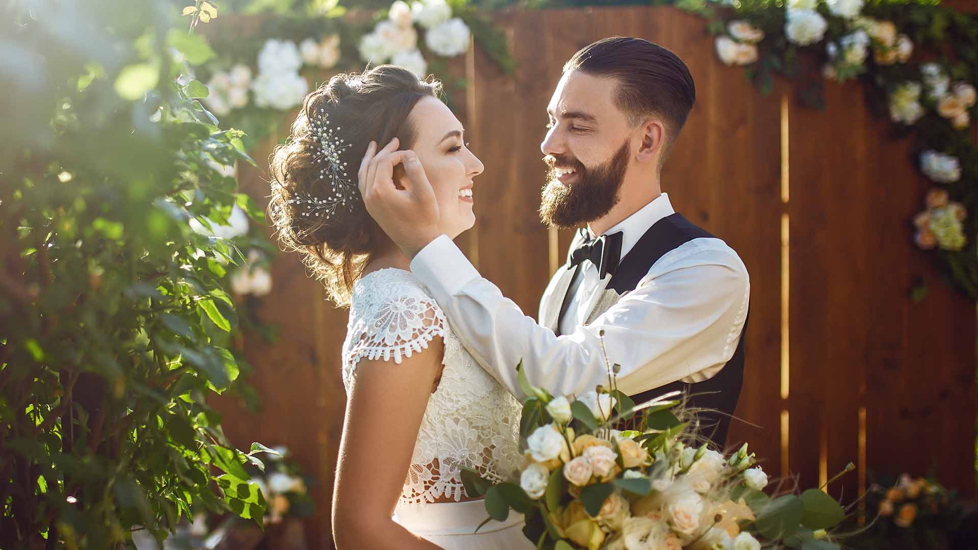 Bride and groom embracing on weeding day