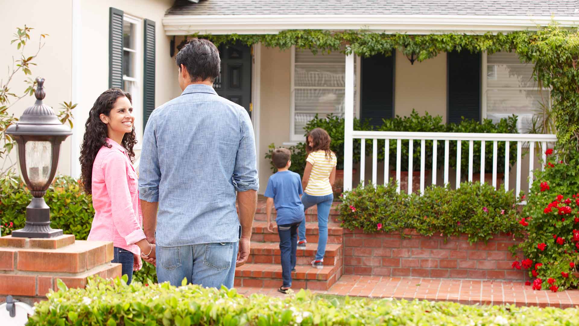 Family Outside New Home