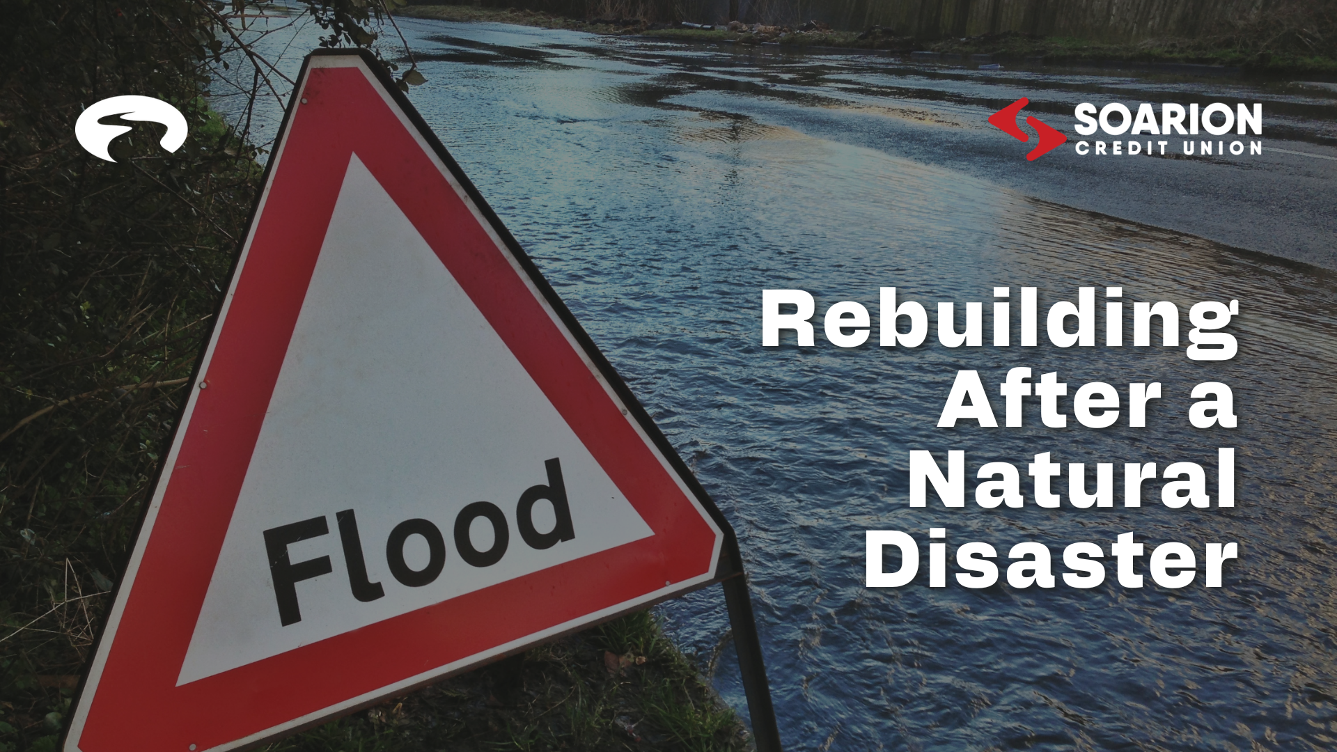 flood sign in front of river