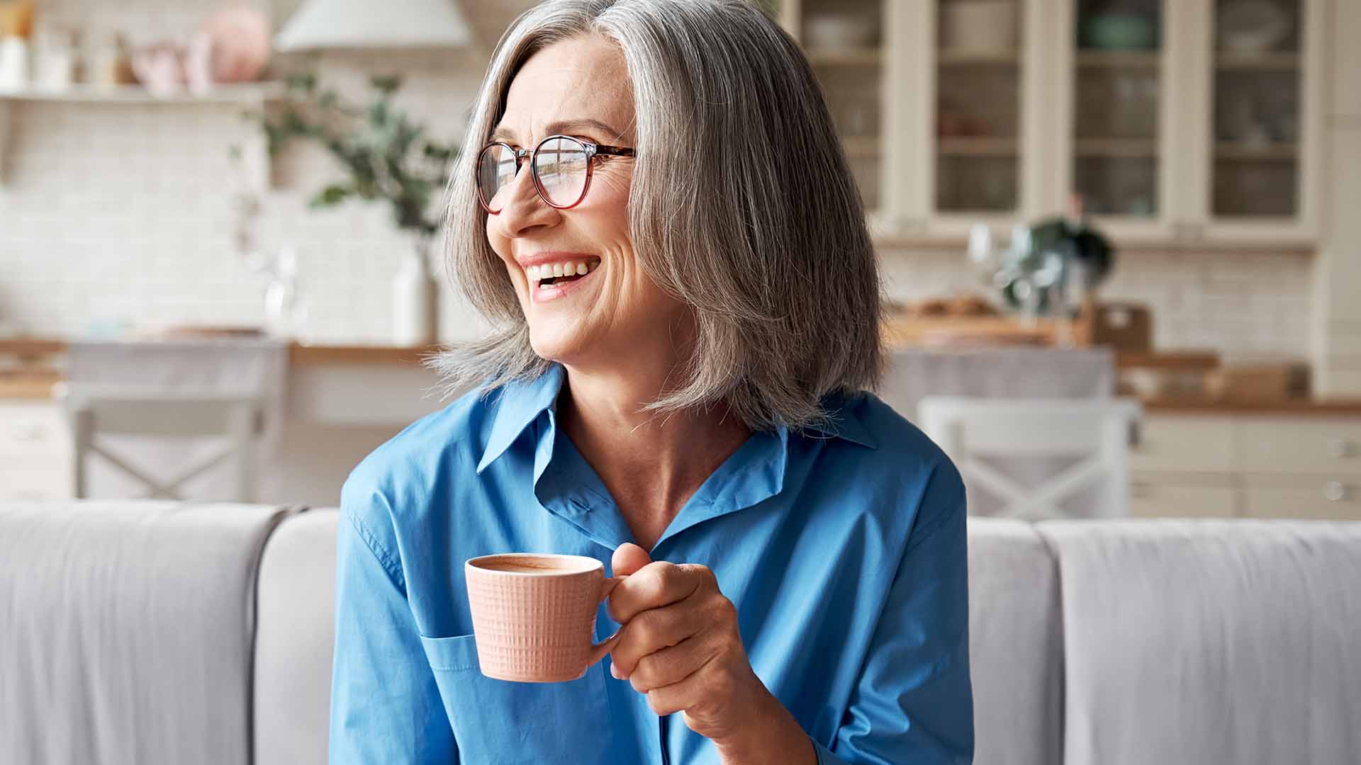 Smiling woman drinking coffee