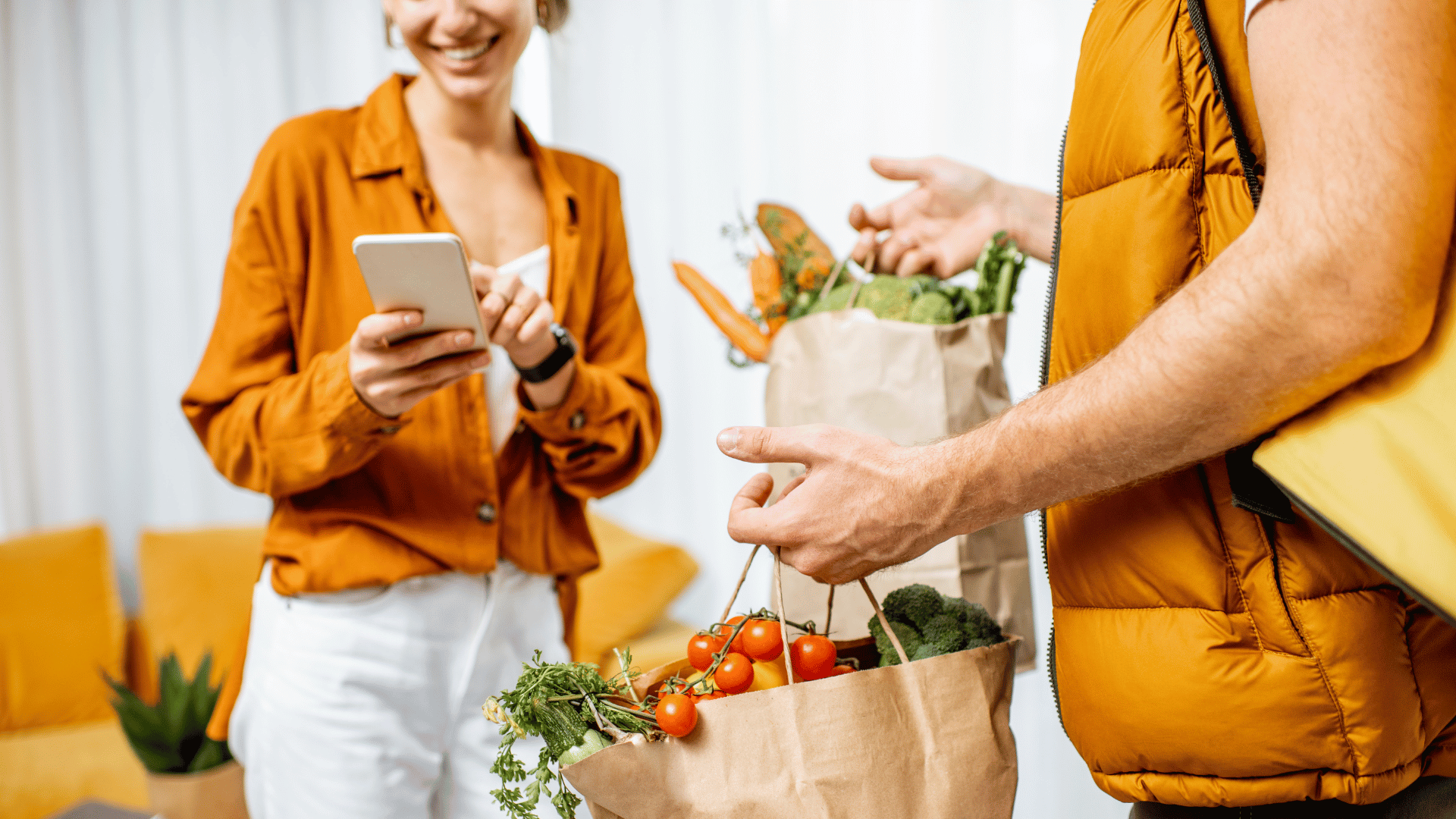 Woman paying for groceries with digital wallet