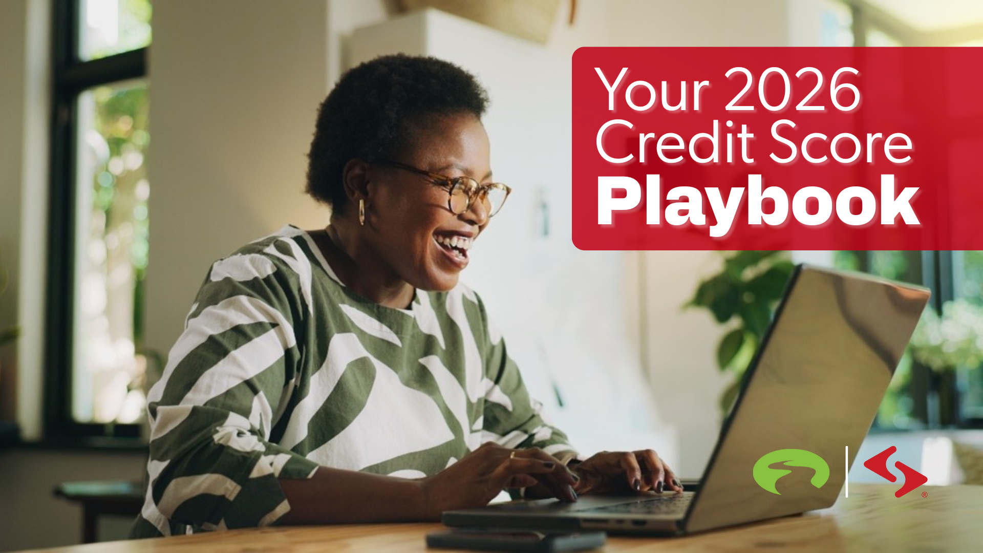 Woman smiling while accessing content on her laptop