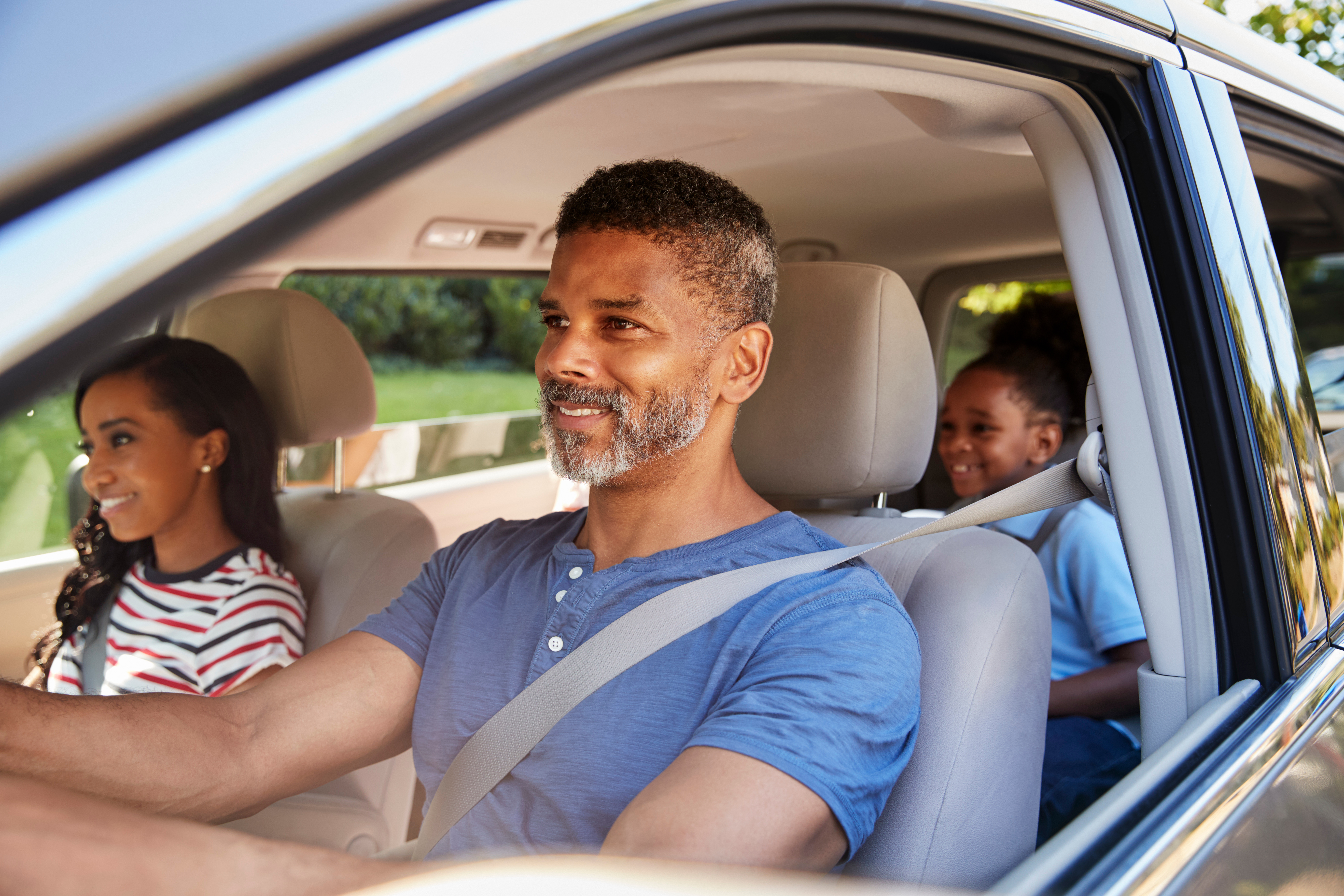 African American Family Enjoying A Road Trip Together